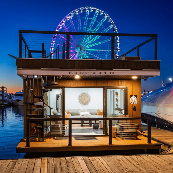 A FLOHOM unit lit up at dusk, in slip at a marina
