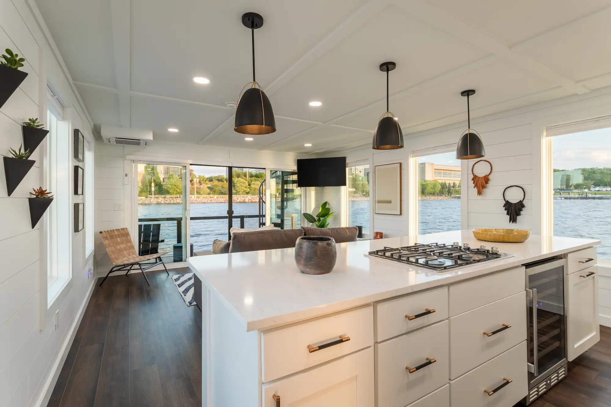 The galley, quartz island and pendant lights